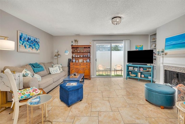 132 S Island Square Dr, Saint Simons Island, GA 31522 - living room featuring a textured ceiling and a brick fireplace