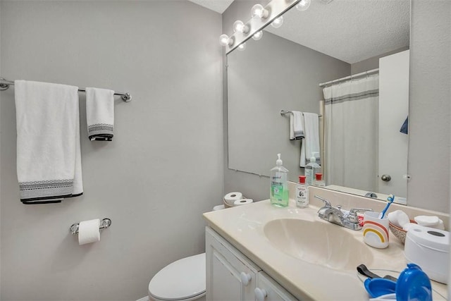 132 S Island Square Dr, Saint Simons Island, GA 31522 - bathroom with vanity, a textured ceiling, and curtained shower