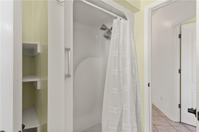 bathroom with tile patterned floors and a shower with shower curtain