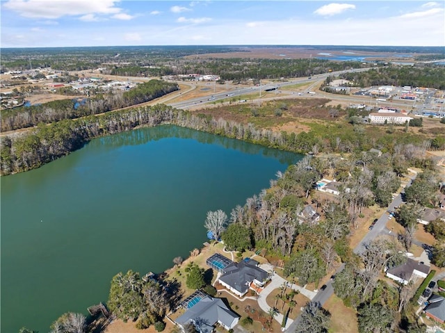 birds eye view of property featuring a water view