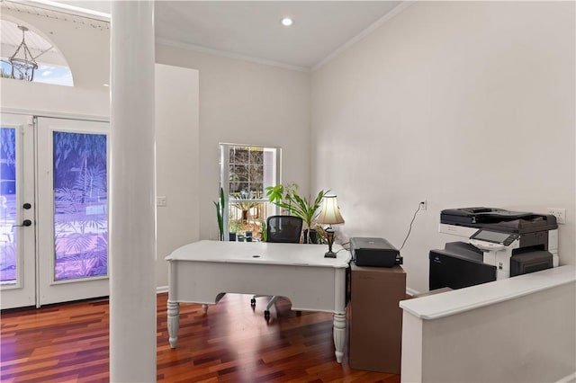 home office featuring crown molding, dark wood-type flooring, and a towering ceiling