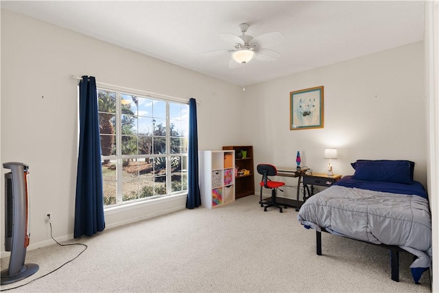 carpeted bedroom featuring ceiling fan