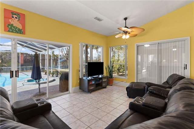 living room featuring ceiling fan and light tile patterned flooring