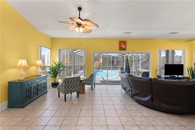 tiled living room with ceiling fan