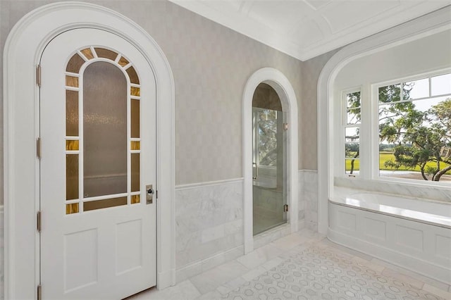 144 Point Ln, Saint Simons Island, GA 31522 - bathroom with a shower stall, a bath, and crown molding