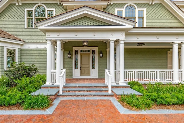 144 Point Ln, Saint Simons Island, GA 31522 - doorway to property featuring covered porch