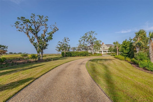 144 Point Ln, Saint Simons Island, GA 31522 - view of asphalt driveway