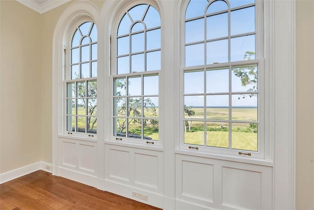 144 Point Ln, Saint Simons Island, GA 31522 - doorway to outside with baseboards, dark wood-style flooring, and ornamental molding