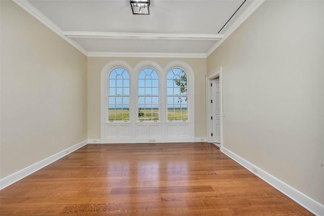 144 Point Ln, Saint Simons Island, GA 31522 - unfurnished room featuring wood finished floors, baseboards, and crown molding