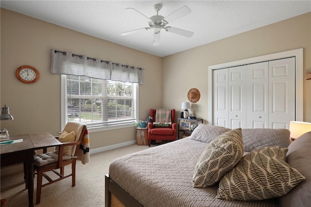 11 Niblick Ct, Saint Simons Island, GA 31522 - bedroom with light carpet, a closet, baseboards, an office area, and a ceiling fan