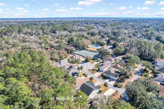 11 Niblick Ct, Saint Simons Island, GA 31522 - view of property location featuring a forest and nearby suburban area