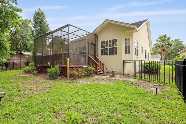 11 Niblick Ct, Saint Simons Island, GA 31522 - rear view of property with stucco siding and glass enclosure