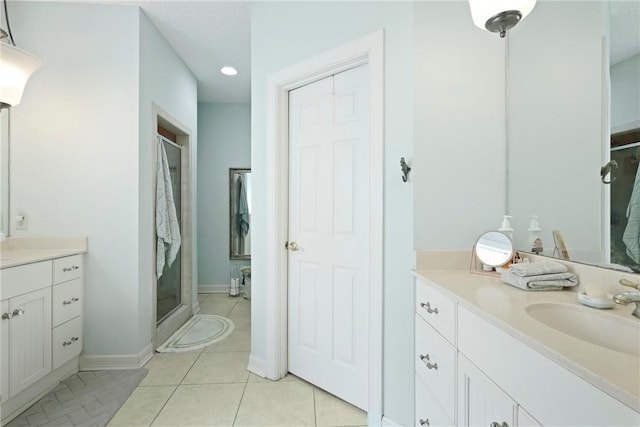 11 Niblick Ct, Saint Simons Island, GA 31522 - bathroom with vanity, a shower stall, recessed lighting, tile patterned floors, and baseboards