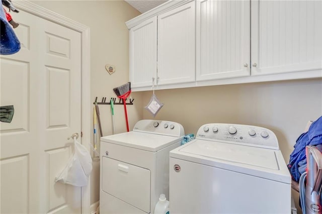 11 Niblick Ct, Saint Simons Island, GA 31522 - washroom with washer and dryer and cabinet space