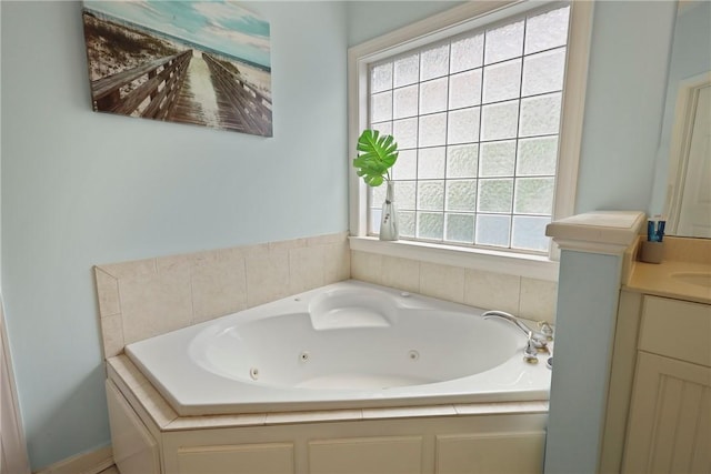 11 Niblick Ct, Saint Simons Island, GA 31522 - bathroom featuring a jetted tub and vanity