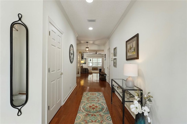 11 Niblick Ct, Saint Simons Island, GA 31522 - hallway with wood finished floors, ornamental molding, recessed lighting, and baseboards