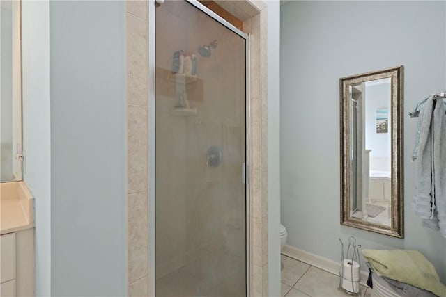 11 Niblick Ct, Saint Simons Island, GA 31522 - bathroom with toilet, vanity, a stall shower, and tile patterned flooring