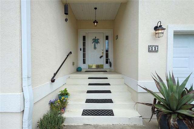 11 Niblick Ct, Saint Simons Island, GA 31522 - doorway to property with stucco siding