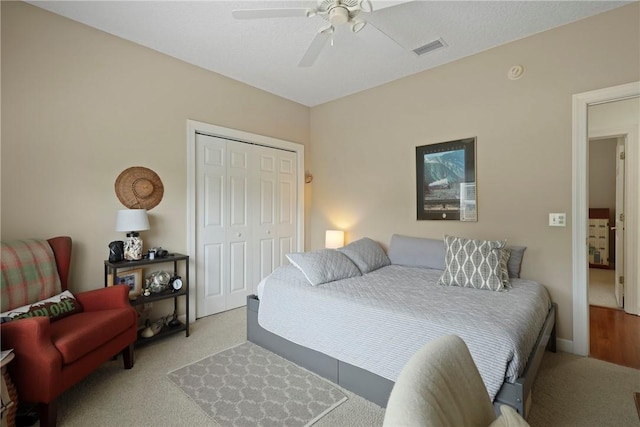 11 Niblick Ct, Saint Simons Island, GA 31522 - bedroom with carpet flooring, a closet, and a ceiling fan