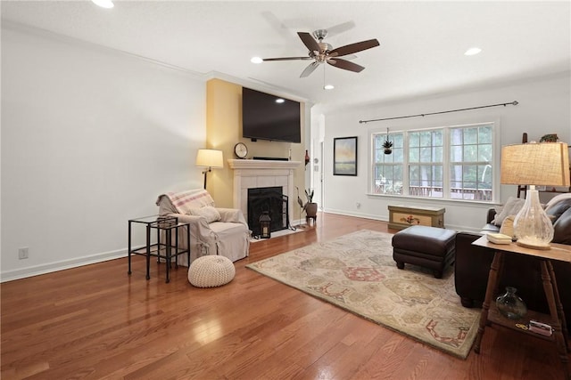11 Niblick Ct, Saint Simons Island, GA 31522 - living room featuring ceiling fan, wood finished floors, a tile fireplace, recessed lighting, and baseboards