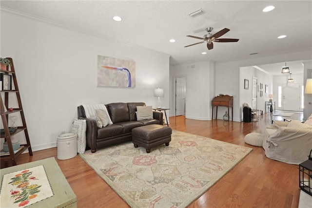 11 Niblick Ct, Saint Simons Island, GA 31522 - living room with ceiling fan, recessed lighting, wood finished floors, ornamental molding, and baseboards