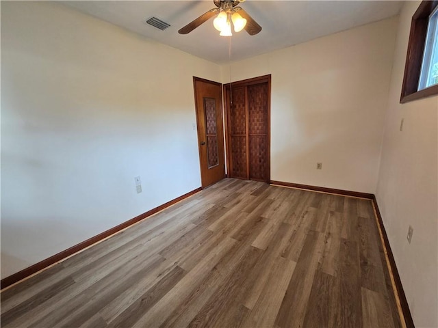 554 Blythe Island Dr, Brunswick, GA 31523 - unfurnished room featuring wood finished floors and ceiling fan