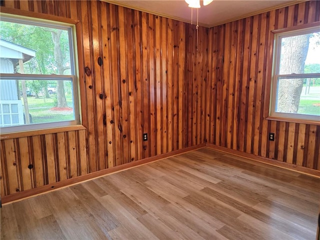 554 Blythe Island Dr, Brunswick, GA 31523 - empty room with wood finished floors and wooden walls
