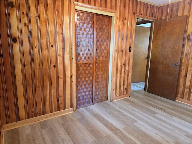 554 Blythe Island Dr, Brunswick, GA 31523 - unfurnished bedroom featuring wood finished floors and wooden walls