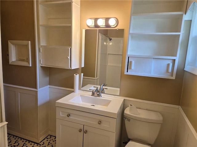 554 Blythe Island Dr, Brunswick, GA 31523 - full bath with a decorative wall, vanity, a wainscoted wall, and a shower