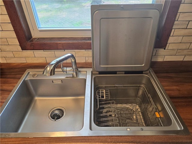 554 Blythe Island Dr, Brunswick, GA 31523 - kitchen view of dark countertops and tasteful backsplash