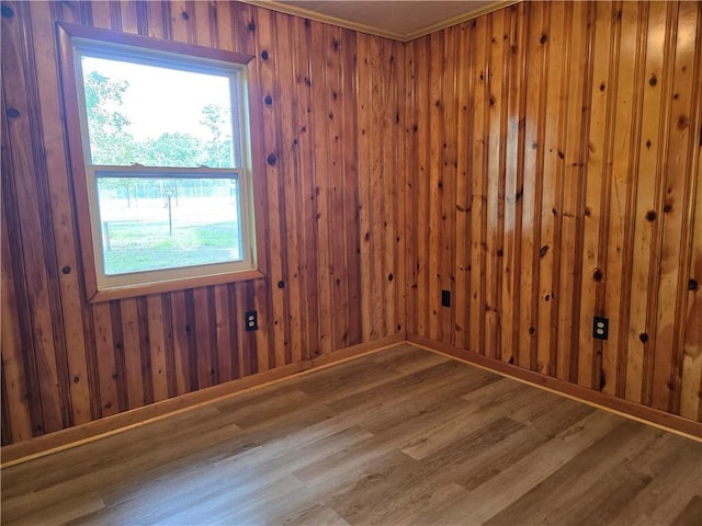 554 Blythe Island Dr, Brunswick, GA 31523 - unfurnished room featuring wood finished floors, plenty of natural light, and wooden walls