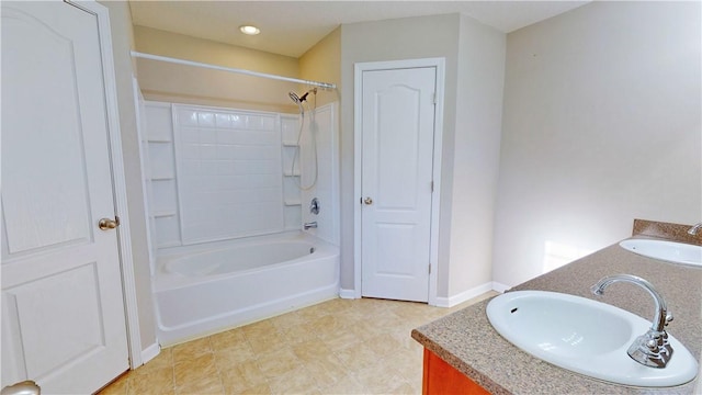 bathroom featuring vanity and shower / bathing tub combination