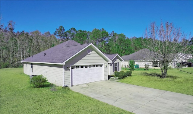 ranch-style home featuring a garage and a front yard