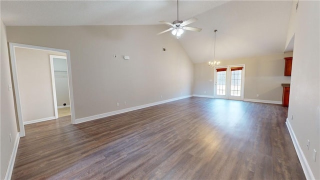 spare room featuring high vaulted ceiling, ceiling fan with notable chandelier, and dark hardwood / wood-style flooring