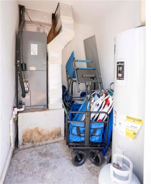 utility room with water heater