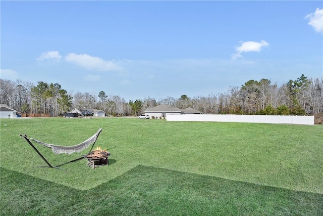 view of yard featuring a fire pit