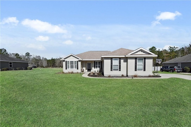 single story home featuring a front lawn