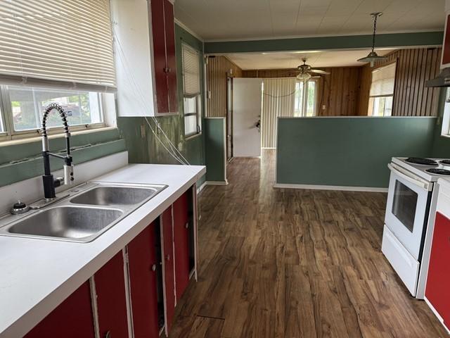 511 Riverside Dr, Waycross, GA 31501 - kitchen featuring white electric range, a sink, and dark wood-type flooring