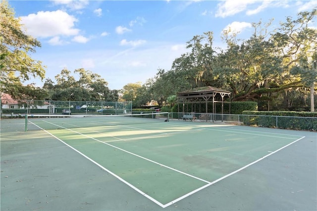 view of tennis court with a gazebo