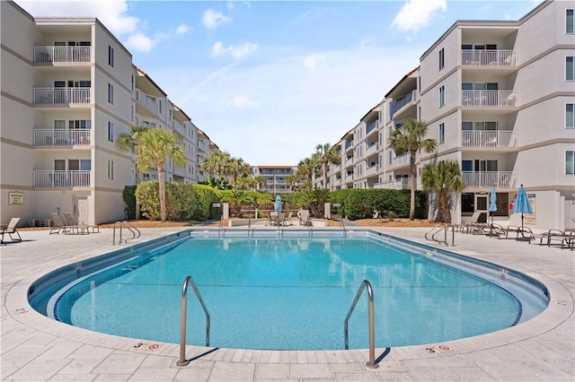 view of swimming pool with a patio