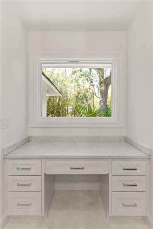 unfurnished office with built in desk