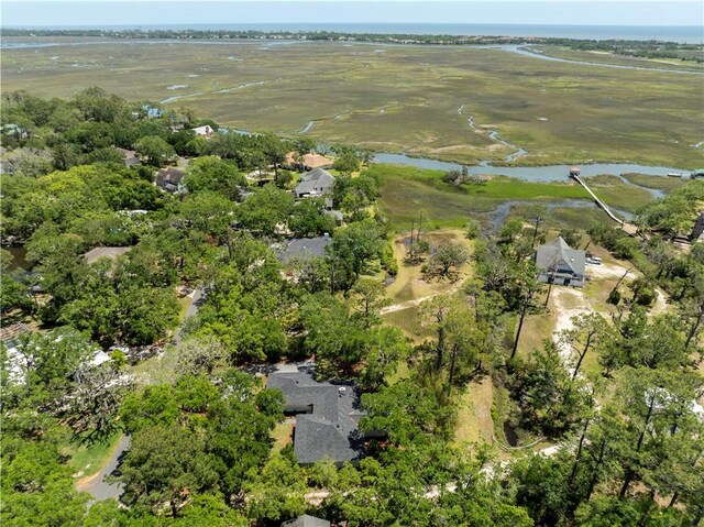 aerial view of property's location featuring a nearby body of water
