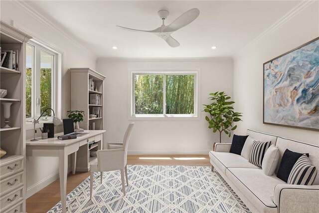 office featuring a ceiling fan, ornamental molding, light wood-style floors, baseboards, and recessed lighting