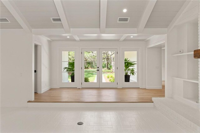 entryway with recessed lighting, beam ceiling, french doors, and wood finished floors