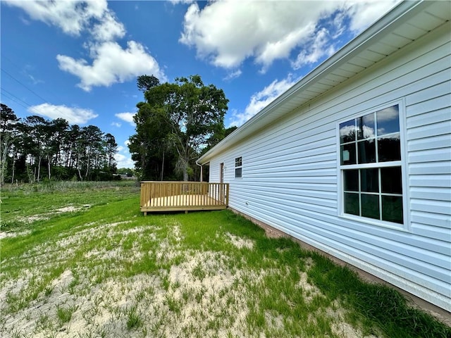 view of yard featuring a wooden deck