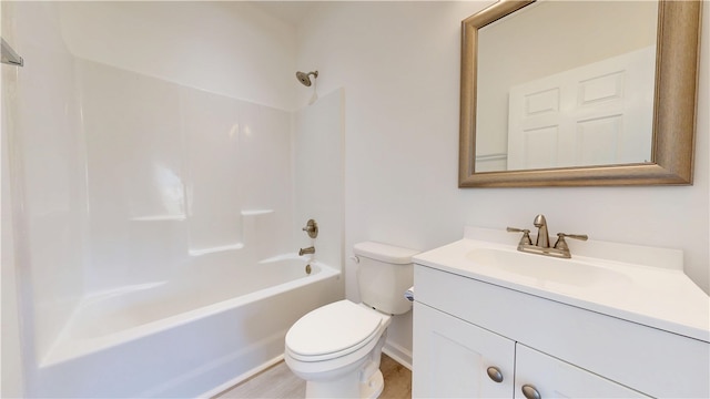bathroom featuring toilet, vanity, and bathing tub / shower combination