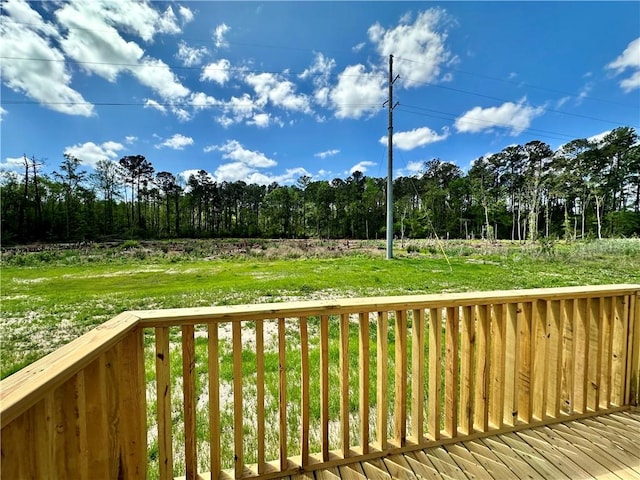 deck featuring a lawn
