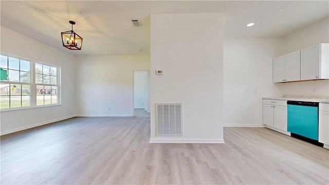 kitchen with baseboards, visible vents, dishwashing machine, and a chandelier