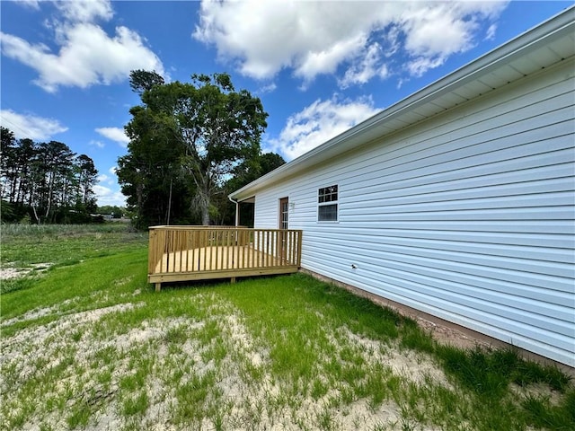 view of yard with a wooden deck