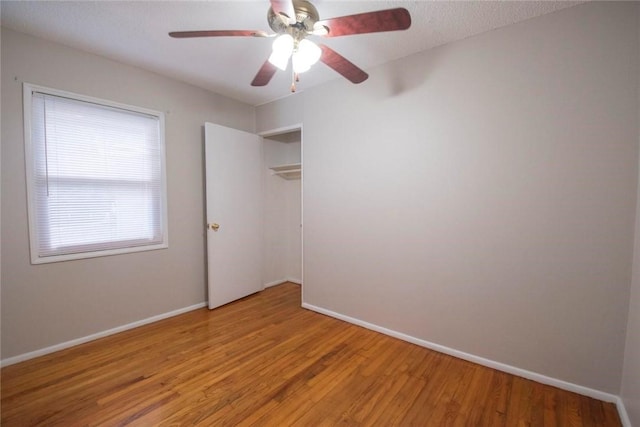 spare room featuring ceiling fan and light wood-type flooring